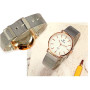 Ezüst színű női karóra, arany színű tokkal. 1118